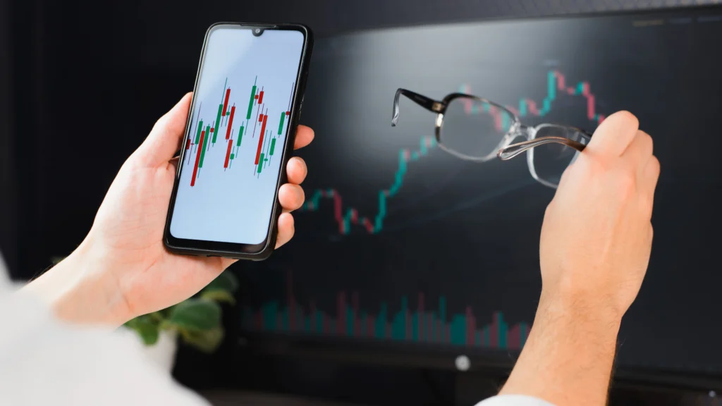 landing_page_get_more02 – PU Prime | More Than Trading traders-looking-at-indices-trading-chart-on-computer-monitor-and-mobile-trading-app