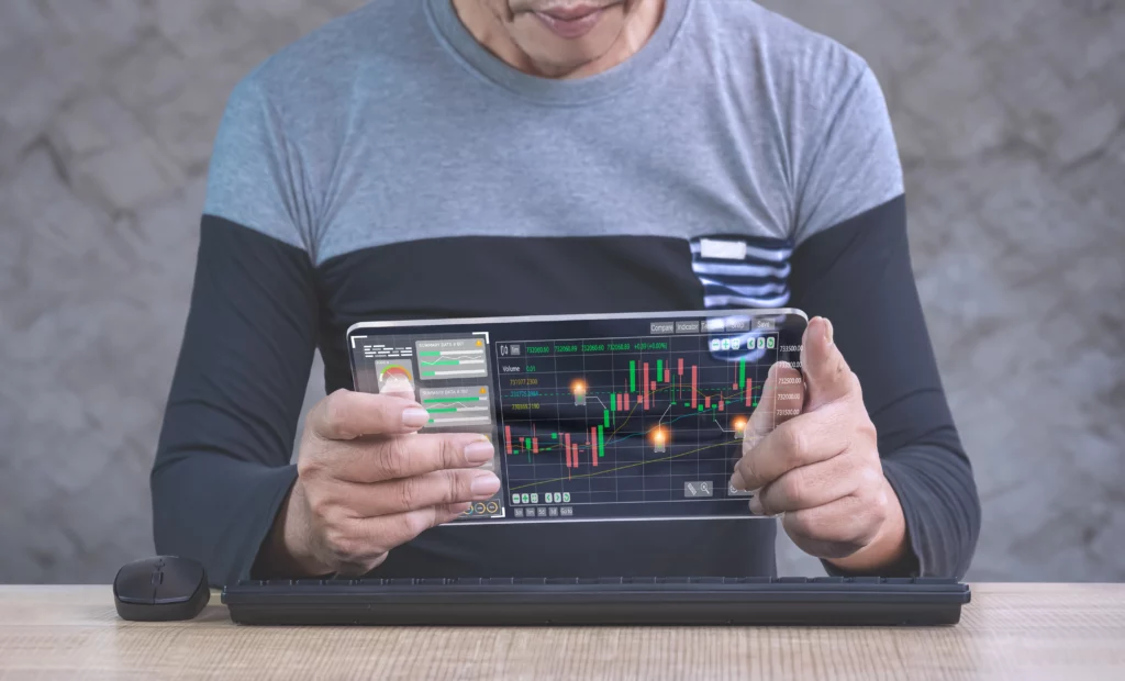 trader-using-transparent-tablet-device-to-analyse-forex-trading-chart – PU Prime | More Than Trading trader using transparent tablet device to analyse forex trading chart